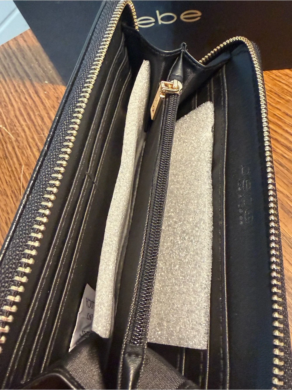 bebe Black Croc-Embossed Zip-Around Wallet with Gold Logo Accent